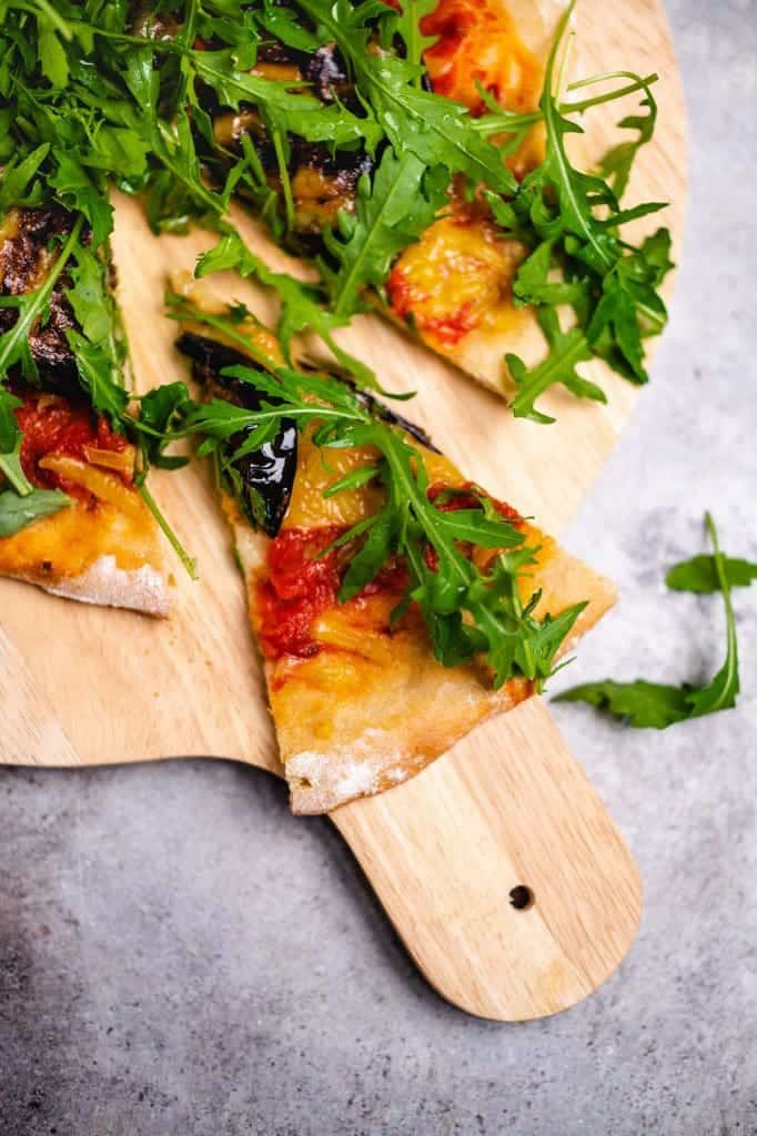 Pizza with grilled eggplant and arugula