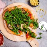 Pizza with grilled eggplant and arugula